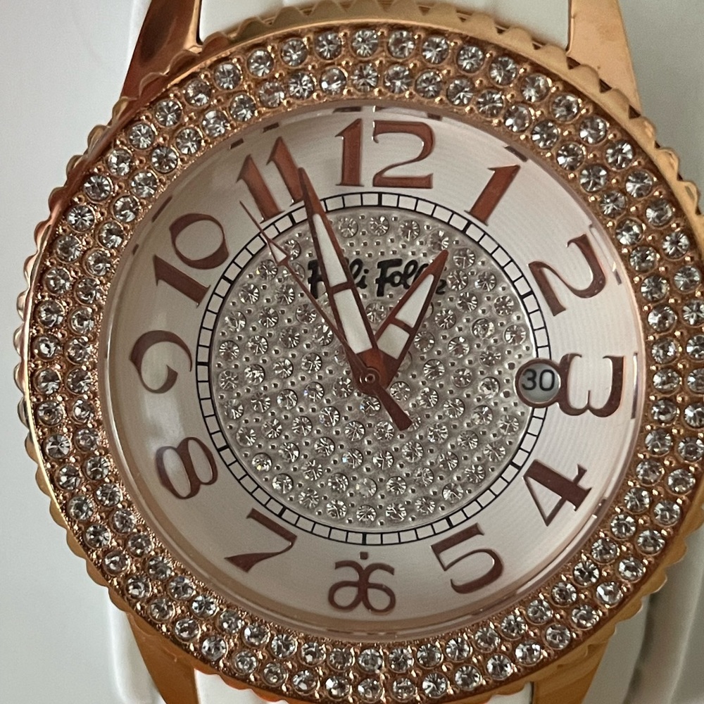 Folli Follie Wrist Watch with Arbonne logo.
